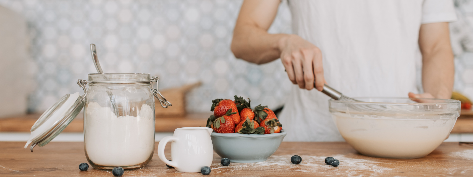 Man whisking in kitchen